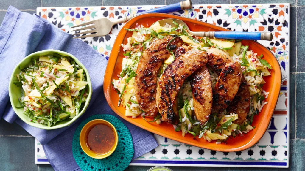 spicy sausages with pineapple rice salad image